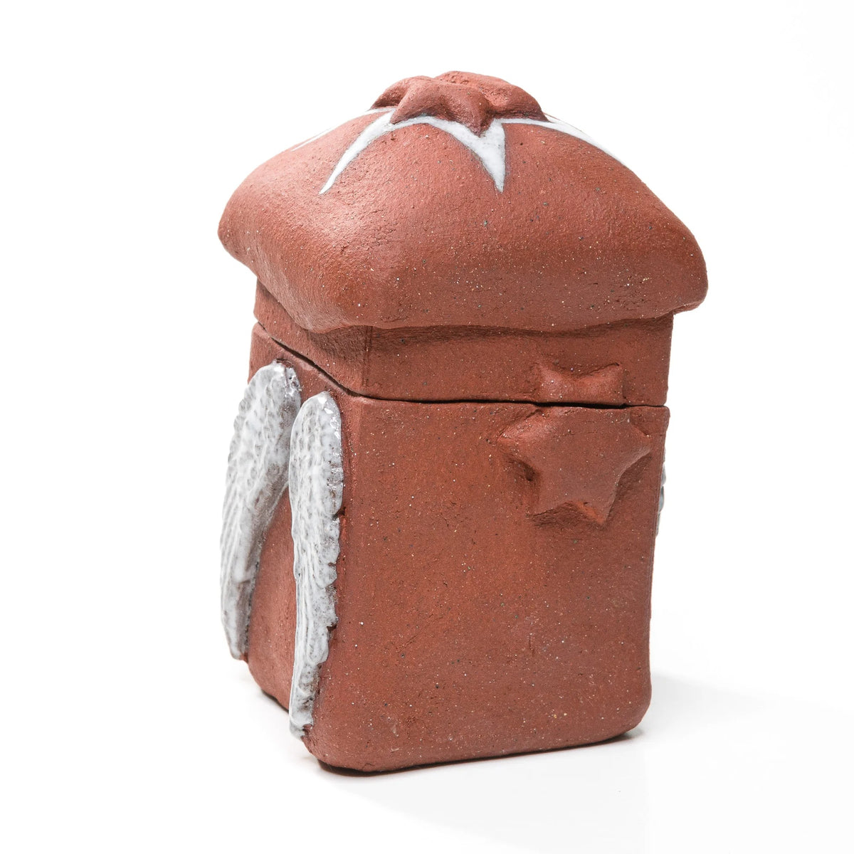 Angled view of a reddish-brown stoneware matchbox with a raised side star, white angel wings and a domed lid