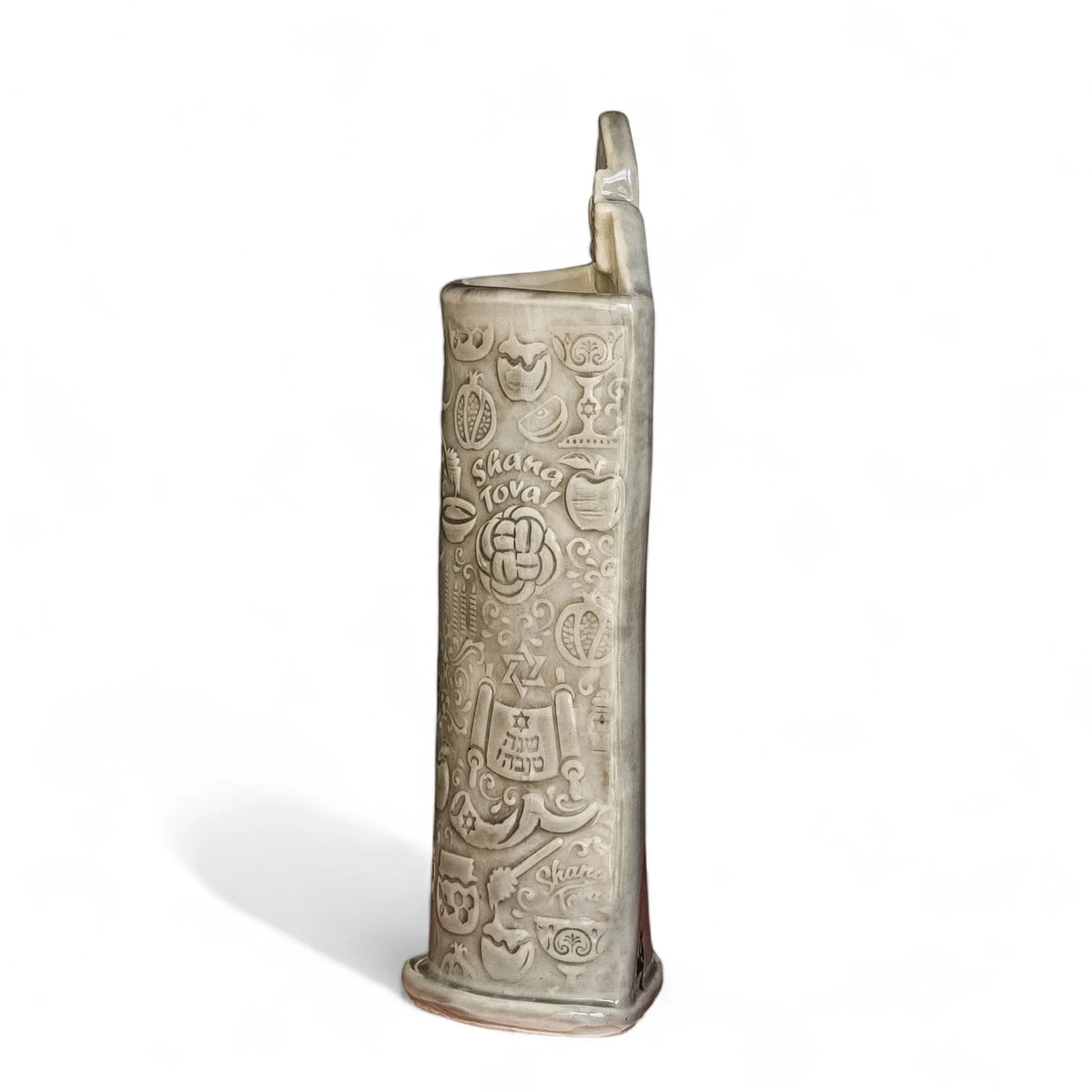 Opposite side of a Shana Tova stoneware vase showing impressed Shana Tova lettering, round challah, and pomegranates.