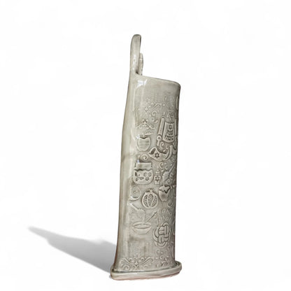 Side view of a Shana Tova stoneware vase with impressed apples, pomegranates, and Jewish holiday symbols.