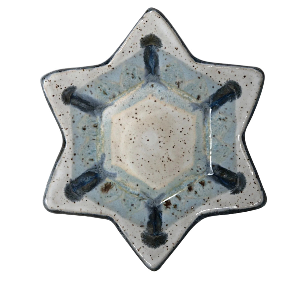 6-pointed Star-shaped ceramic dish with speckled white and pale blue glaze, dark blue accents, and a dark rim.
